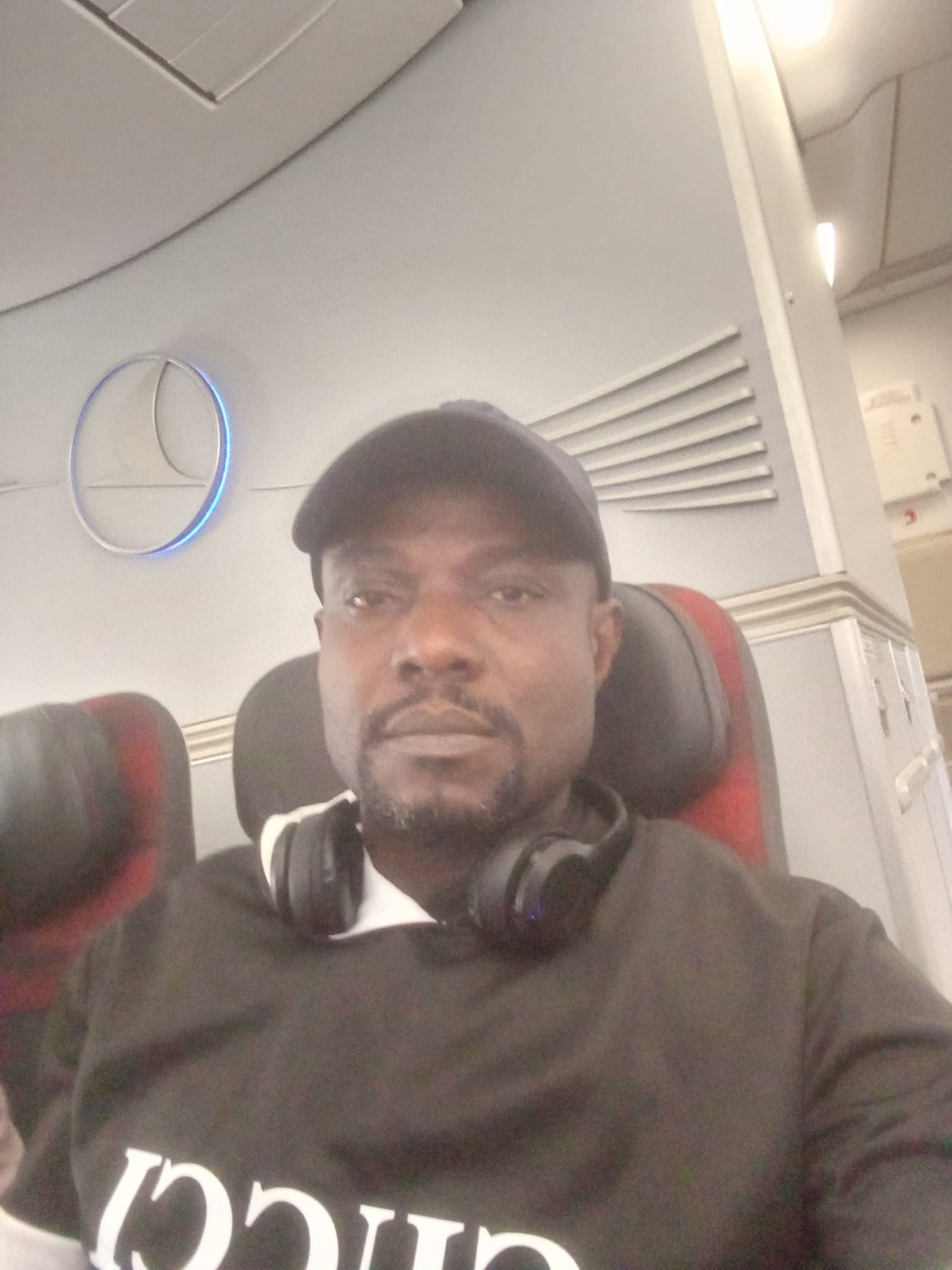 In an aircraft cabin, by the door