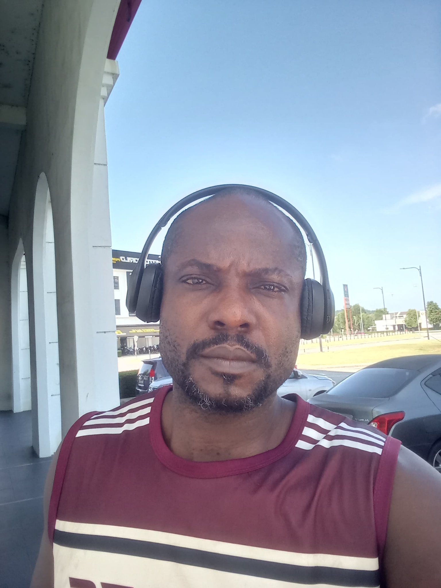 Outdoors, headphones on