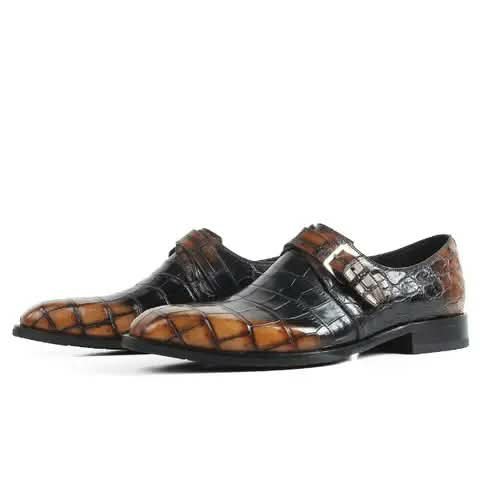 Monk strap shoes with a black and tan croc pattern.