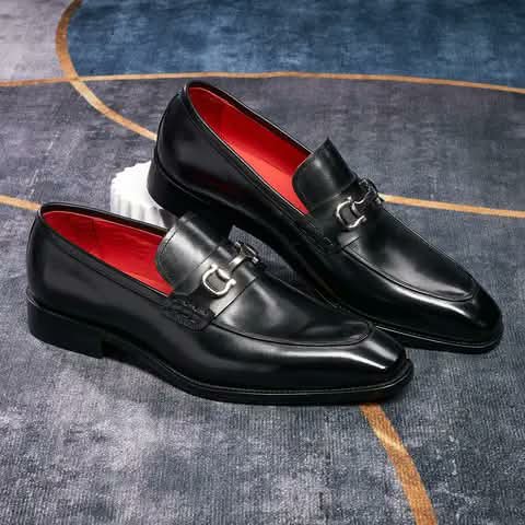 Black bit loafers with red lining.