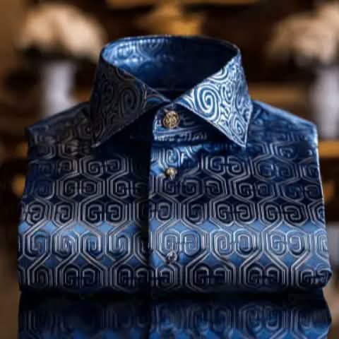 A folded blue shirt with a geometric pattern.