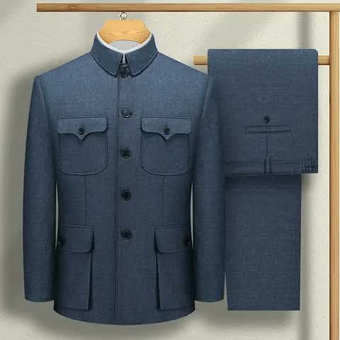 A blue-grey safari suit — jacket and trousers on a rail.
