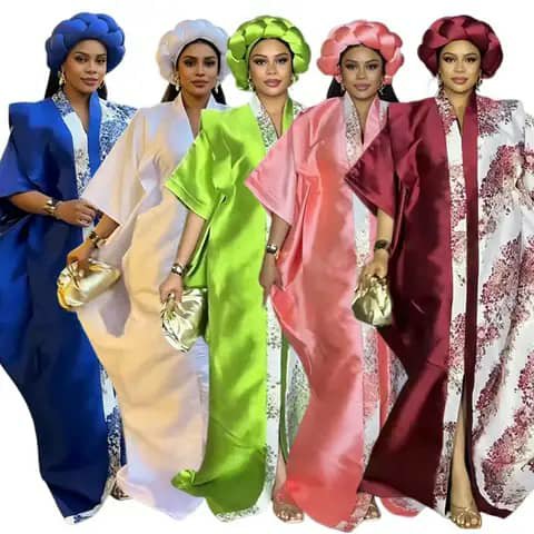 Five women wearing satin boubou gowns with matching headwraps in blue, white, green, pink and burgundy, holding clutches.