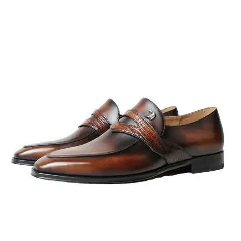 Brown loafers with a croc-pattern strap.