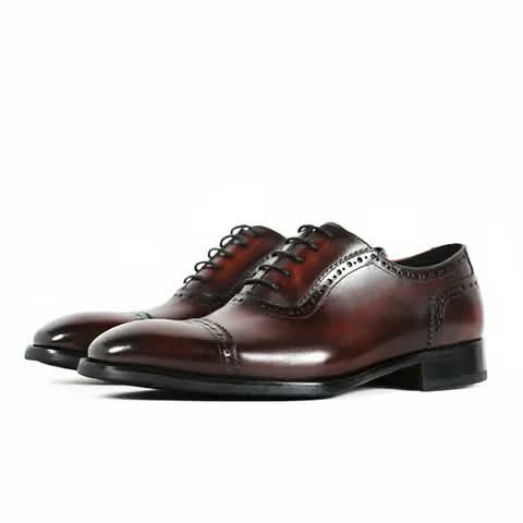 Burgundy brogue Oxford shoes.