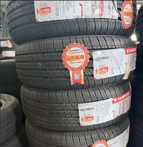 Stack of four car tyres, 195/60R16