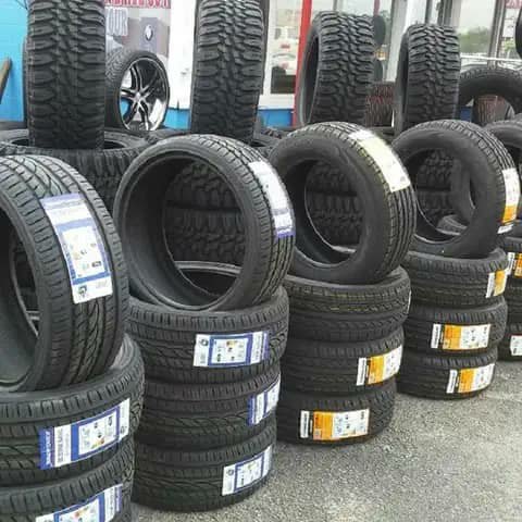 Stacks of car tyres at a tyre shop