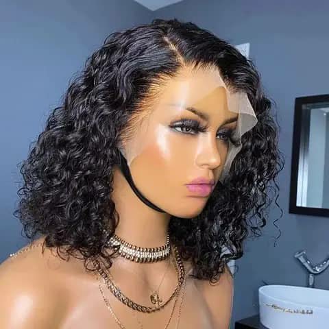 A short dark curly bob wig on a mannequin head wearing necklaces.