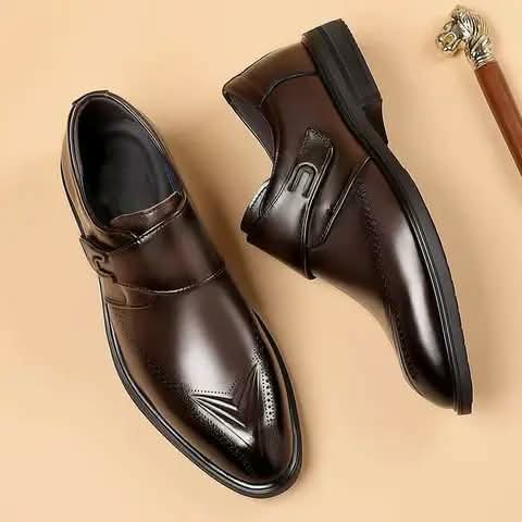 Dark brown monk strap shoes seen from above.