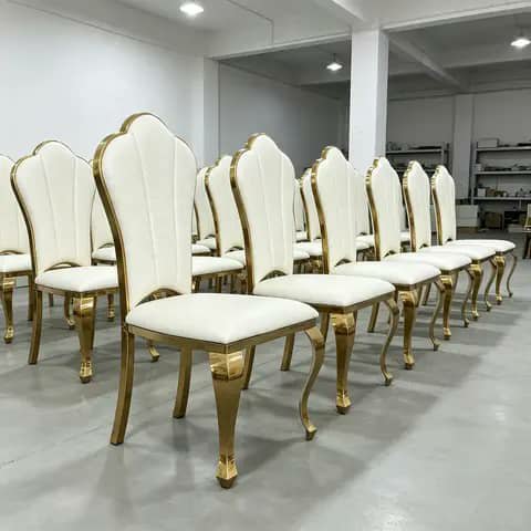 Row of white and gold dining chairs