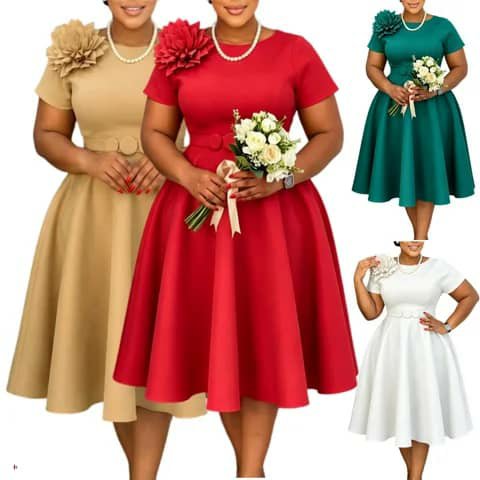 Four women wearing A-line dresses in beige, red, green and white with a flower detail at the shoulder.