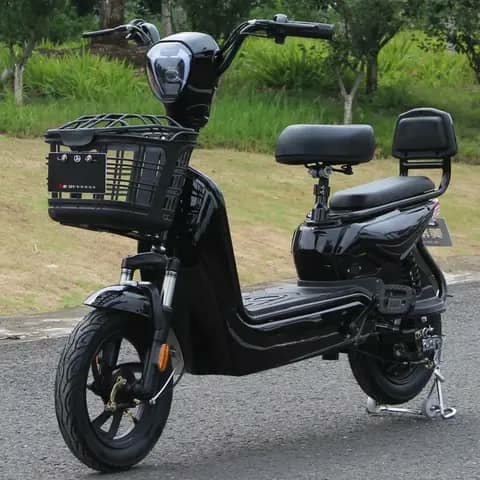 Black electric scooter with front basket, outdoors