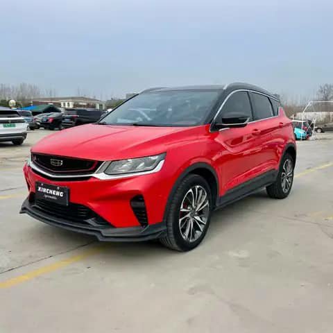 Red Geely SUV in a lot