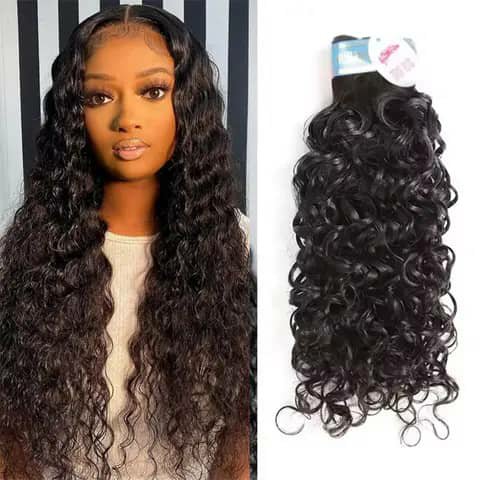 A woman wearing long dark curly hair beside a bundle of the same curly hair.