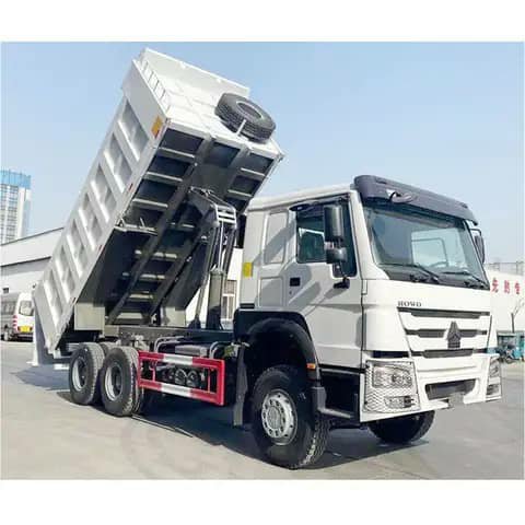 White HOWO dump truck with bed raised