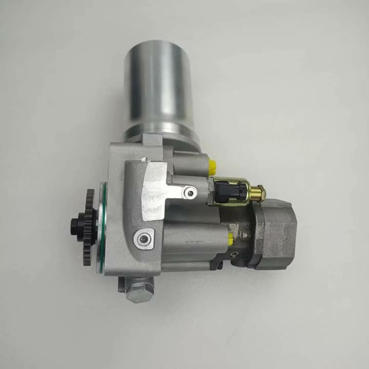 A silver hydraulic pump with a black gear and yellow caps, on a white background.