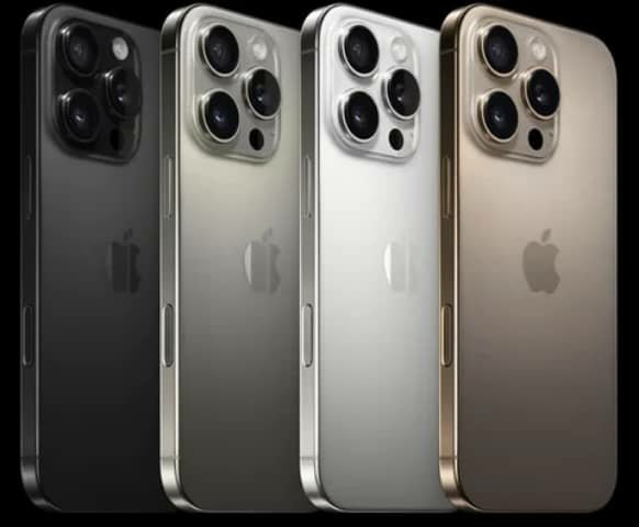 Four iPhone Pro phones standing in black, grey, silver and gold