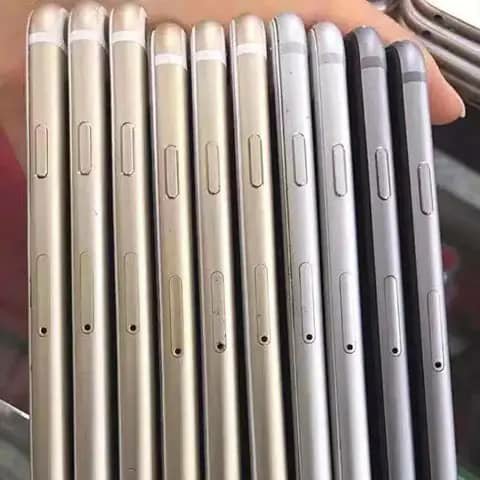 Eight iPhones held, shown from the side, gold silver and black