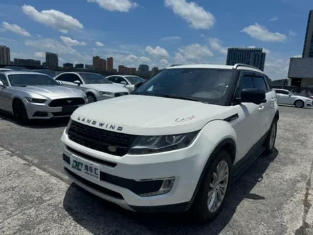 White Land Wind SUV in a lot