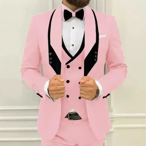 Pink suit with black lapels and bow tie