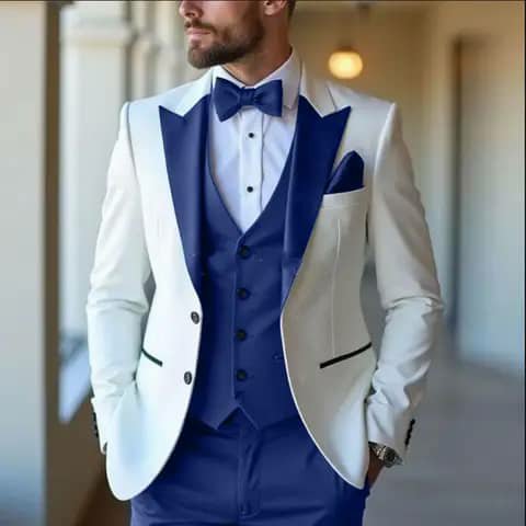 White suit with royal blue vest, trousers and bow tie