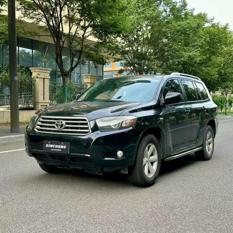 Black Toyota Highlander SUV on a street