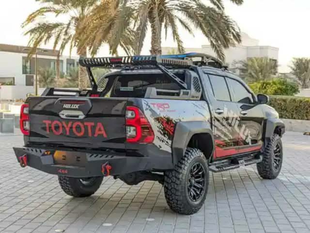 Black Toyota Hilux TRD pickup, rear view